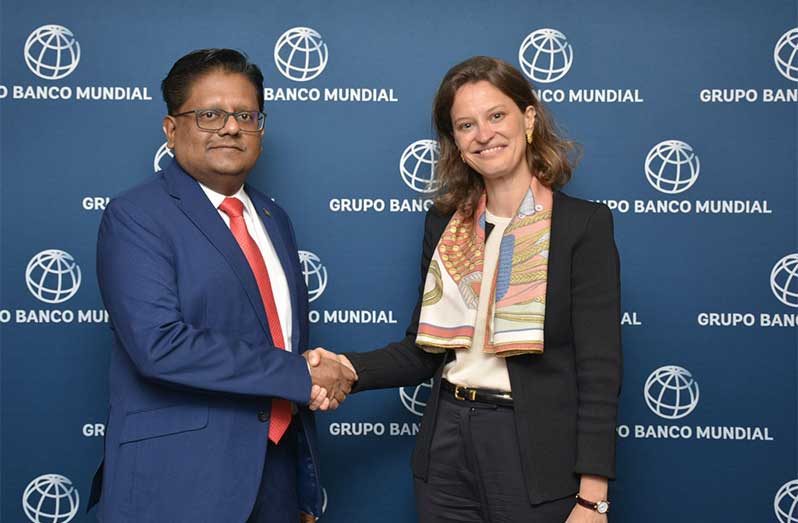 Senior Minister in the Office of the President with Responsibility for Finance, Dr. Ashni Singh, and World Bank Vice- President for Latin America and the Caribbean Susana Cordeiro Guerra