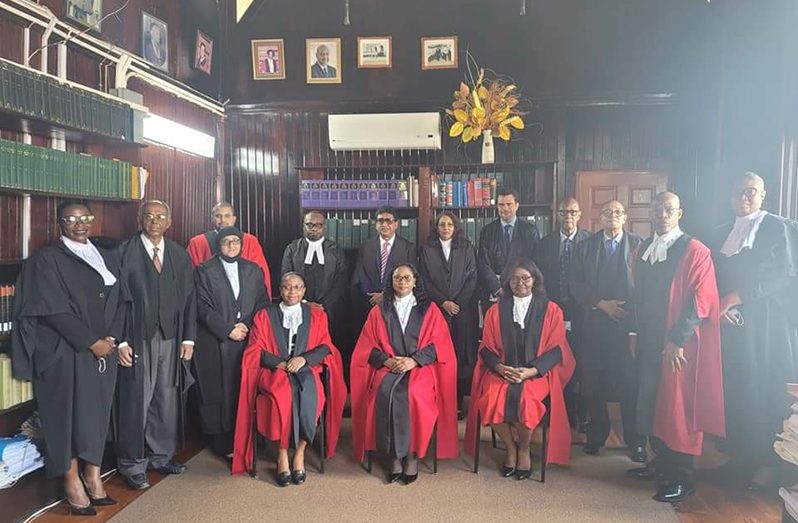 The newly appointed Senior Counsel with (seated from to left to right) Chief Justice, Roxane George SC; Chancellor of the Judiciary, Justice Yonette Cummings-Edwards, and Court of Appeal Judge, Dawn Gregory. Also picture several judges and lawyers
