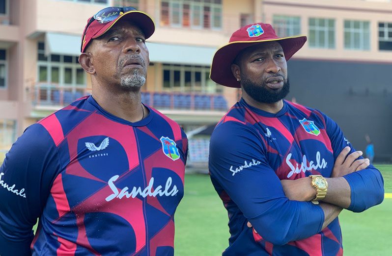 West Indies head coach Phil Simmons (left) and T20 captain Kieron Pollard