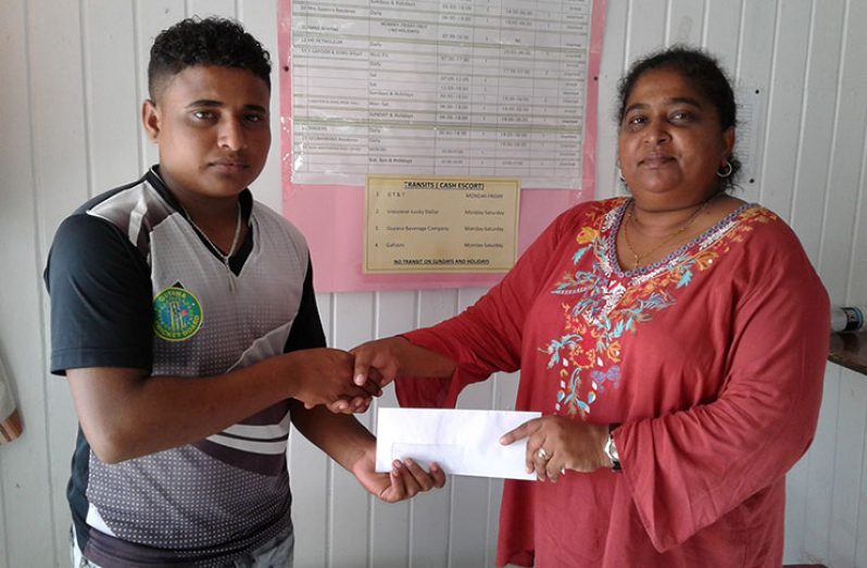 Sentinel’s Berbice manager Priya Rampersaud hands over sponsorship to RHTY&SC                         Assistant Secretary/CEO Simon Naidu.