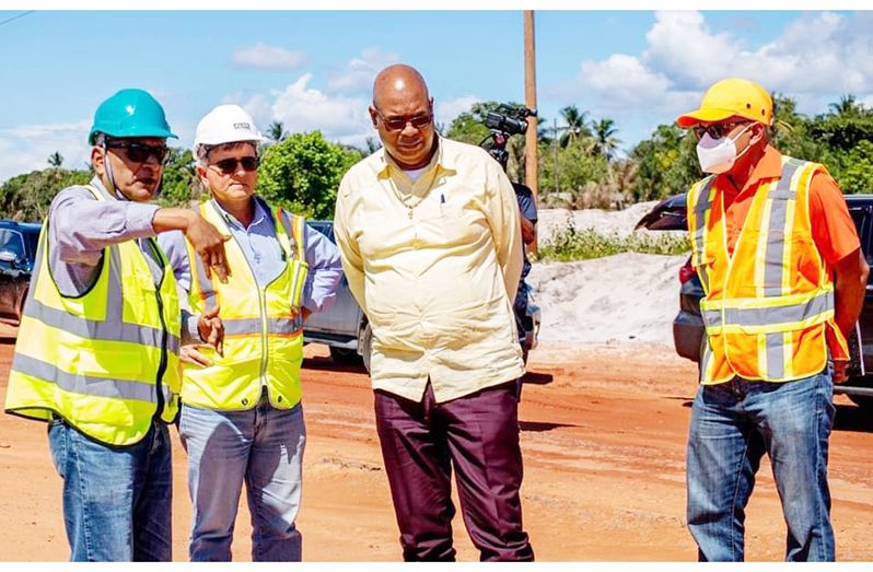 Minister of Public Works, Bishop Juan Edghill, engages contractors on the site of the Linden-Mabura Hill Road project