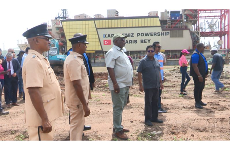 Prime Minister, Brigadier (Ret’d) Mark Phillips, Senior Minister within the Office of the President with responsibility for Finance and the Public Service, Dr Ashni Singh and Head of GPL’s Executive Management Team, Kesh Nandlall, at the site of the ship at Everton, Region Six, on Saturday (DPI photo)