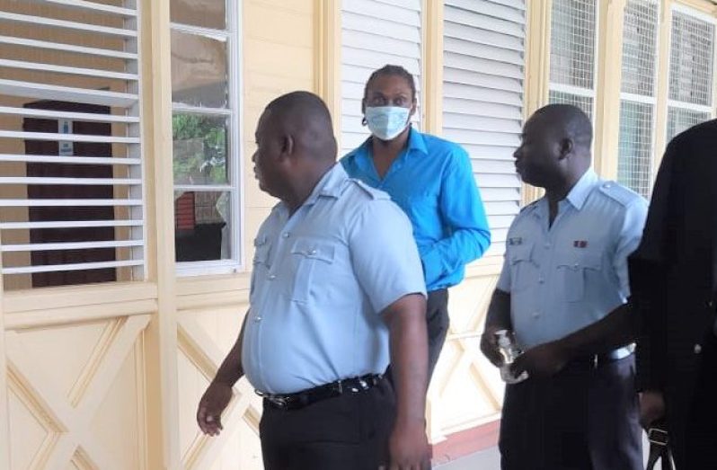 NICK SKEETE, called ‘Jason Blair’ and ‘Shatta’ being escorted by the police along the corridors of the High Court