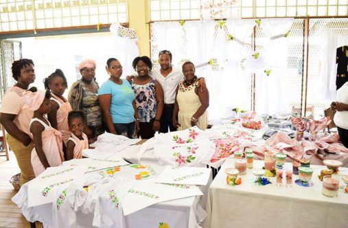 MP Jermaine Figueira with some of the programme’s beneficiaries