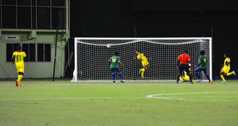 Tevin Slater (no. 12) scores for St. Vincent and the Grenadines against Guyana in their 2018 World Cup Qualifier match at the Guyana National Stadium. (Samuel Maughn photo)