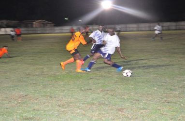 Part of last Friday night’s action between Slingerz Football Club (orange) and Beavers in this year’s Vitamalt/Aqua Mist WDFA Knockout Championships.