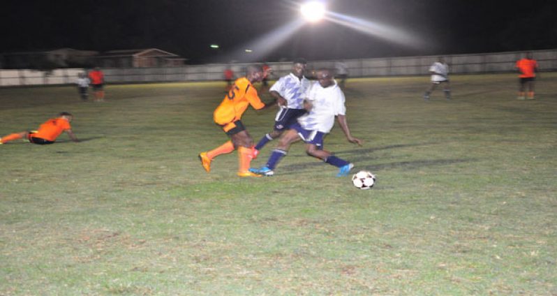 Part of last Friday night’s action between Slingerz Football Club (orange) and Beavers in this year’s Vitamalt/Aqua Mist WDFA Knockout Championships.