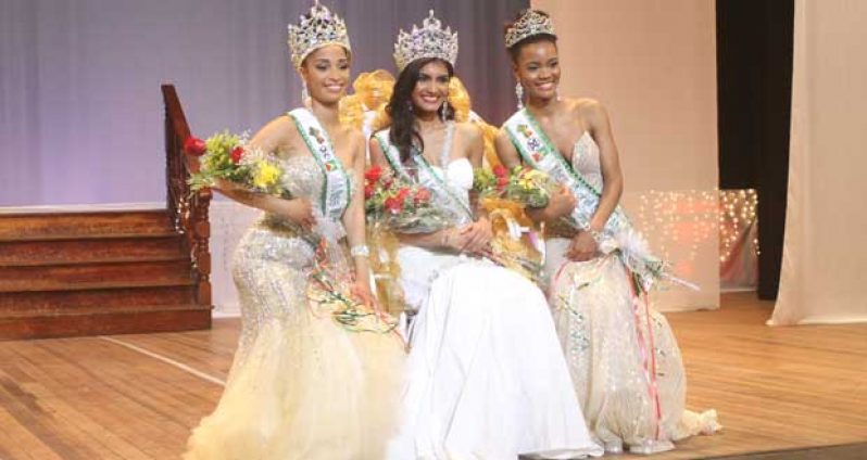 New queen, Rafieya Husain (center) first runner-up, Atisha Gaskill (left), and second runner-up, Deneica Williams were all smiles after they received their respective pageant placing.