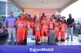 Minister of Education Sonia Parag, President of ExxonMobil Guyana Alistair Routledge, among other ExxonMobil Guyana staff, along with John Ramsingh of FL Sport, with the championship side, Therese’s Primary School