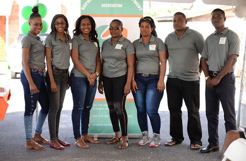 SOCDA Treasurer Sidney Nelson (extreme right) and Stacey Gordon – SOCDA Community Dialogue and Volunteer Coordinator (second from left) standing among other members of the association (Delano Williams photo)