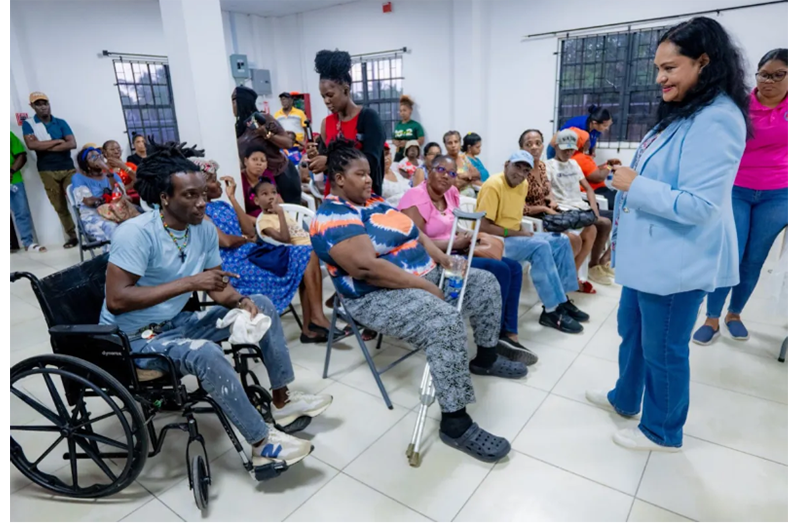 Minister of Human Services and Social Security, Dr Vindhya Persaud, engaging Sophia, Georgetown residents during an outreach on Friday