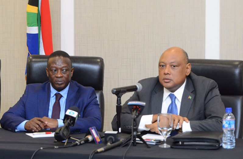 Minister of Natural Resources Raphael Trotman and Deputy Minister of Mineral Resources of the Republic of South Africa, Godfrey Oliphant addressing reporters during a press conference at the Marriott (Samuel Maughn photo)