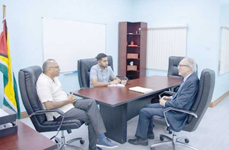 Minister of Health, Dr. Frank Anthony, with Mr. Fernando Varela, Economic and Commercial Counsellor of the Embassy of Spain, and Mr. Sachin Person, Operating Manager at the Ministry of Health, during a meeting at the Brickdam office