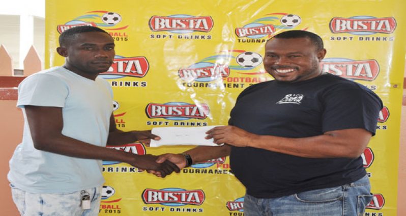 Devon Millington, captain of Sparta Boss, is all smiles as he collects the $600 000 cash prize from Petra Organisation director Troy Mendonca.
