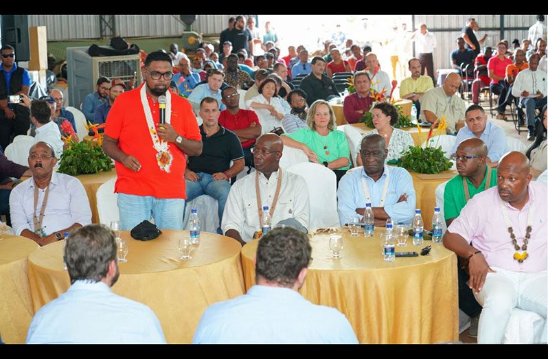President, Dr Irfaan Ali speaking at the Caribbean-Roraima Investors Luncheon at the Santa Fe farm in the North Rupununi as Antigua and Barbuda Prime Minister Gaston Browne (left), Trinidad and Tobago Prime Minister Dr Keith Rowley (right) and regional officials pay keen attention (Office of the President photo)