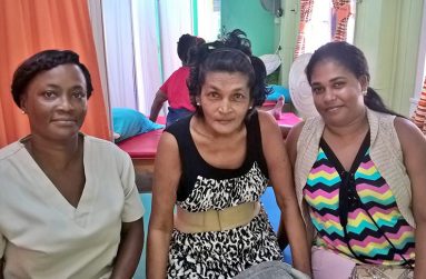 Latchmin Khan (centre) with her daughter-in-law Amanda Sewdin (right) and Rehabilitation Assistant Karen Garnett