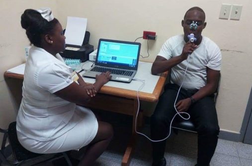 A patient being tested with the spectrometer