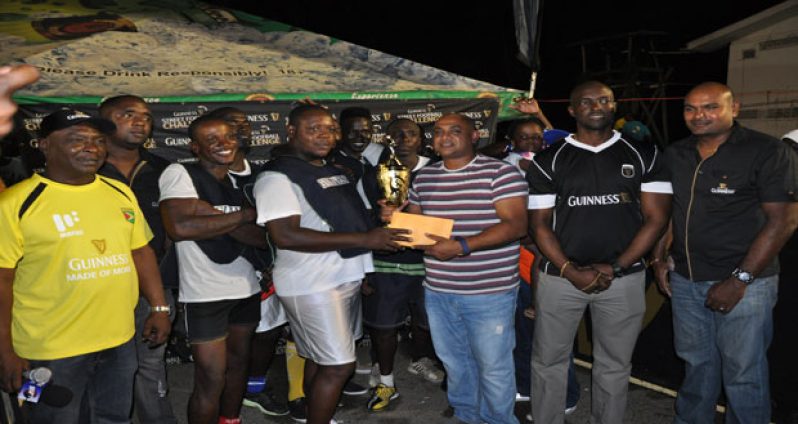 Champions!!! Manchester receive their spoils after capturing the inaugural Berbice edition of the ‘Guinness Greatest of de Streets’. Representatives of Bank DIH and orgainsers of the competition are seen flanking the victors.