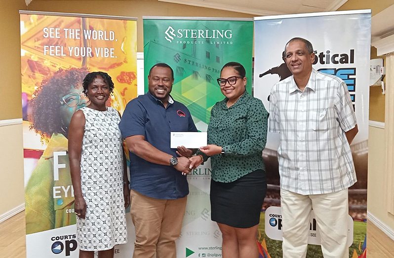 Sterling Products Limited’s PRO, Youlandra McCammon (2nd right), hands over the sponsorship cheque to Petra Organisation Co-Director Troy Mendonca, in the presence of SPL CEO, Ramsay Ali, and Petra’s Lavern Fraser-Thomas