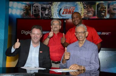 Digicel Group COO, Andy Thorburn, and Patrick Rousseau, Chairman of IMC and SportsMax (front row left and right) celebrate with Phillip Martin, Deputy Chairman of IMC and SportsMax (standing left) and Oliver McIntosh, CEO of SportsMax (standing right).
