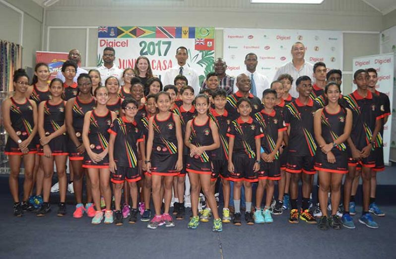 The contingent of junior squash players who will be participating in the Junior CASA, along with various representatives of the sponsors and GSA vice-president David Fernandes (Tamica Garnett photo)