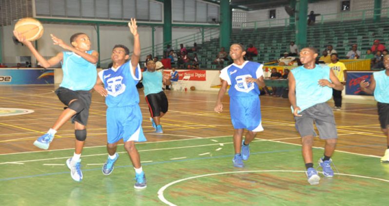 Going all the way! St Rose’s point guard Kwesi Roberts going all the way to the basket against Marian Academy during his team’s 25 – 19 semi-final win in the NSBF U-14 category. (Delano Williams photo)