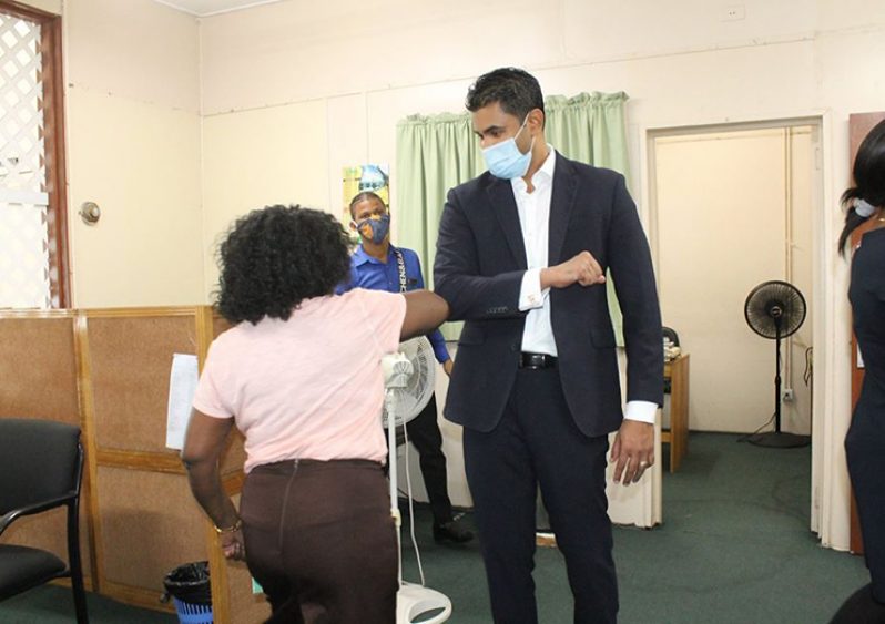 : Minister of Culture, Youth and Sport, Charles Ramson Jr, greets a staff member during his first visit to the facility, yesterday. (Photo compliment: MCYS)
