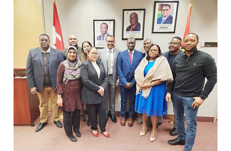 Foreign Secretary Robert Persaud (fourth from left) and Ambassador Keith George (fourth from right) with staff of the Guyana Consulate in Toronto. Also pictured is Consul General (ag) Grace Joseph (second from left).