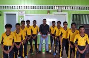 BCCC U-15 team, attired in their spanking new coloured uniforms, compliments of Trophy Stall and Mike’s Floor Covering Inc. of New York. At entre stands BCCC president Shabeer Baksh.