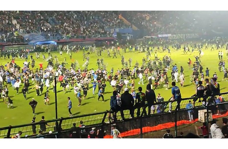 Angry football fans invaded the pitch.