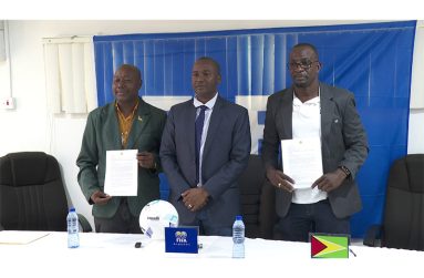 Right is Wainwright Bethune, President of the Upper Demerara Football Association (UDFA), and Rickford Profitt, President of the East Coast Demerara Football Association with GFF President Wayne Forde (centre)