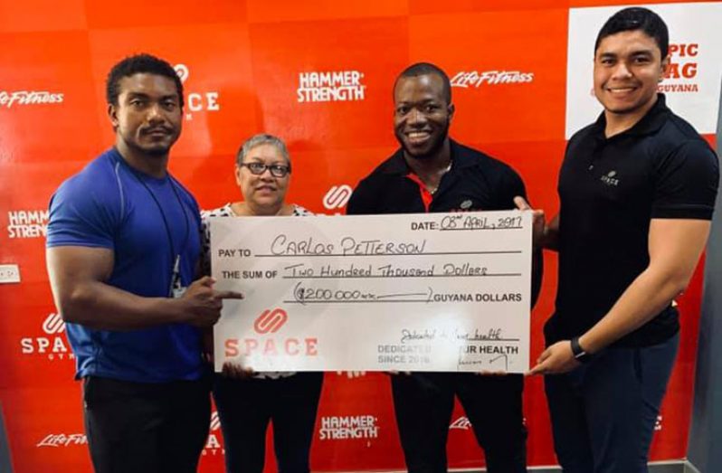 Carlos Petterson-Griffith received the sponsorship cheque from Space Gym Guyana on Wednesday afternoon.