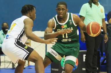Stanton Rose (#11) being pressed by Adrian Mike during Guyana's 87-107 defeat to Jamaica in El Salvador. (Photo compliments: GABF/FIBA)