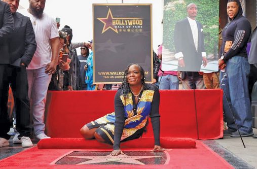 Sekyiwa 'Set' Shakur and Director Allen Hughes pose with the star of Rapper Tupac Shakur during its posthumous unveiling ceremony on the Hollywood Walk of Fame in Los Angeles, California, U.S. on June 7, 2023 (REUTERS/Mario Anzuoni)