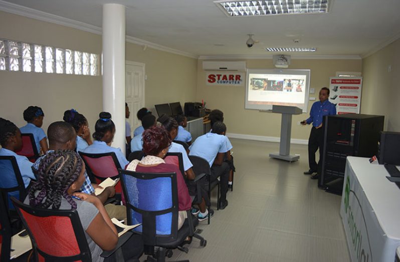 Starr Computers Inc’s, Michael Mohan, sharing his vast IT experience with his young visitors from the Mahaicony Technical and Vocational Training Centre