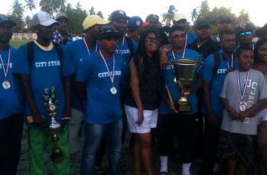 The victorious City Stars lineup strike a pose with Roy Ramloogan (black jersey) and his family, after claiming their fourth successive Roy Ramloogan/PMCC Softball Cup.