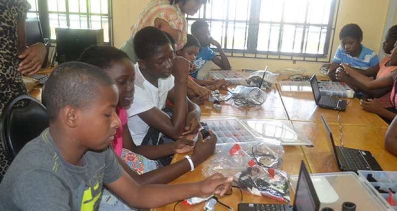 Students from the Buxton-Friendship, East Coast Demerara area participating in the STEM, Guyana Robotic Camp at the Friendship Primary School.