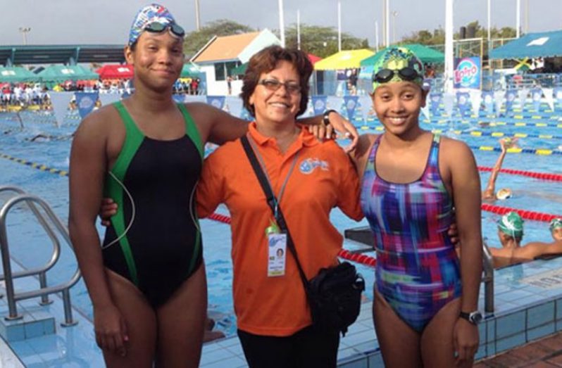 Swim coach Stephanie Fraser (centre), with two of her most accomplished swimmers, olympian Britany van Lange (left) and Soroya Simmons