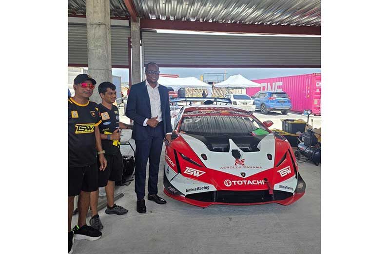 Minister Steven Jacobs alongside one of the teams and one of the cars that will be on show this weekend.