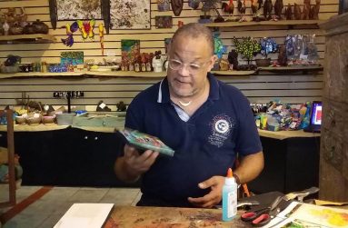 Stephen Murphy at his shop, Zemi displaying raw materials used to make art and craft.