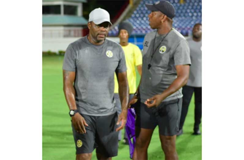 Former Trinidad and Tobago International Stern John (left)