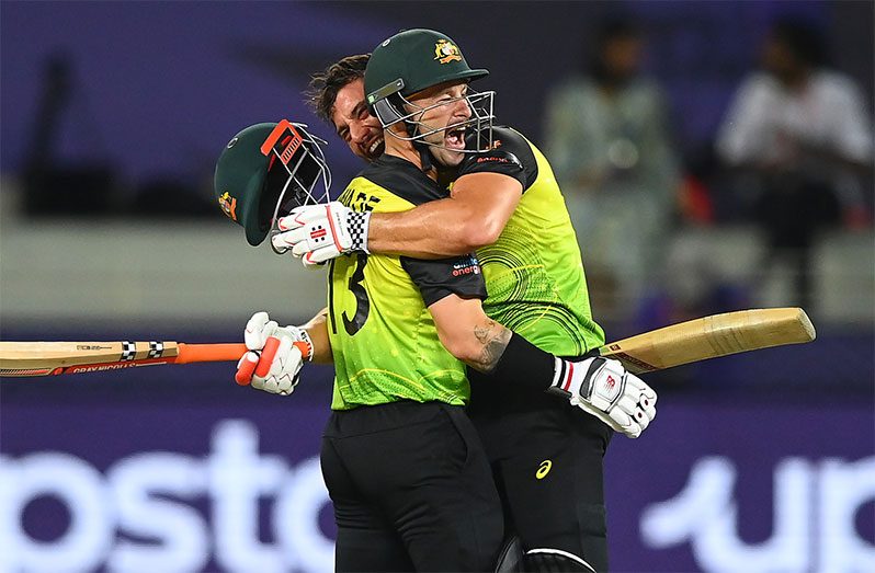 Australia’s Marcus Stoinis and Matthew Wade celebrate a five-wicket win over Pakistan in the T20 World Cup semi-final