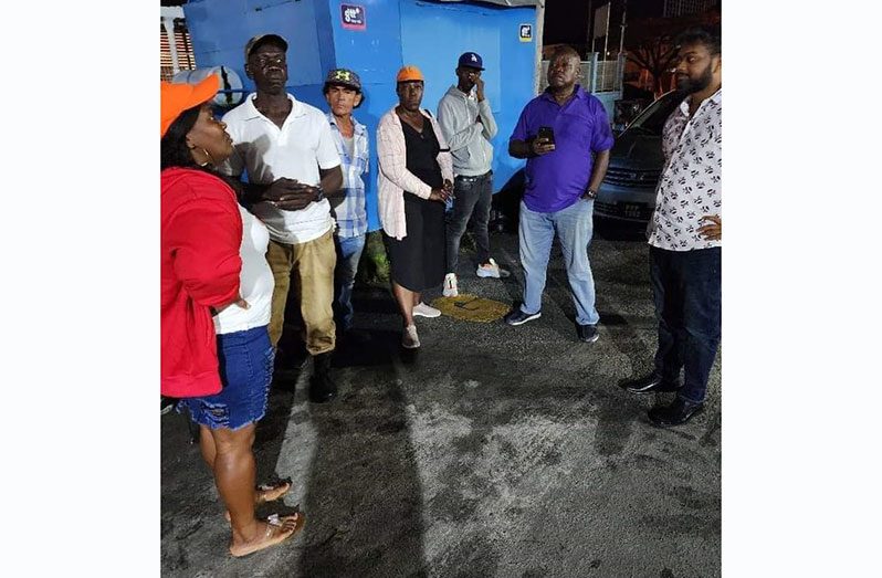 Leader of the Opposition Aubrey Norton engages vendors on Monday evening (Leader of the Opposition photo)