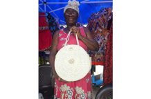 Juneann Taylor displays a straw bag specially handmade for a customer