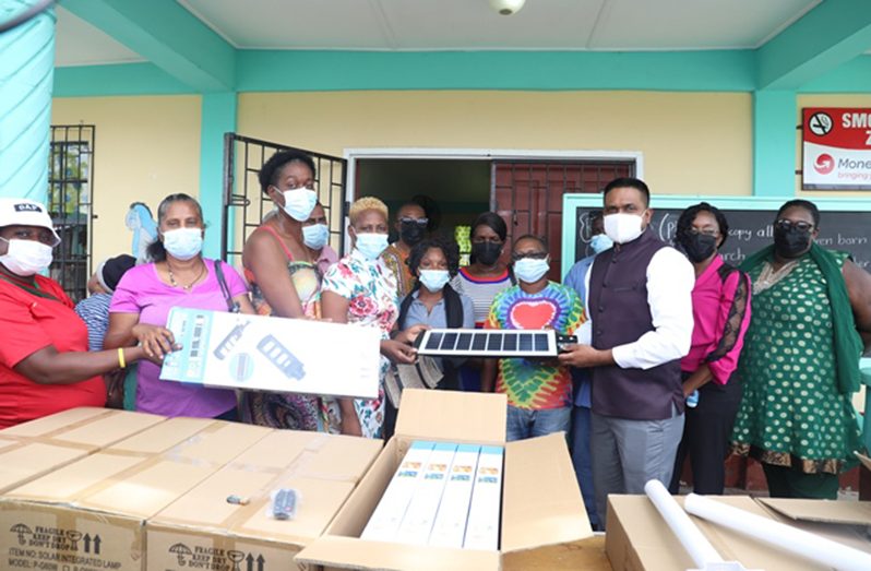 Minister of Local Government and Regional Development, Nigel Dharamlall, handing over the streetlights to residents of Sophia (DPI photo)