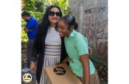 Minister of Human Services and Social Security, Dr. Vindhya Persaud and Reeanna shared a light moment after the latter was presented with a brand-new laptop, a gesture that left the young student visibly moved