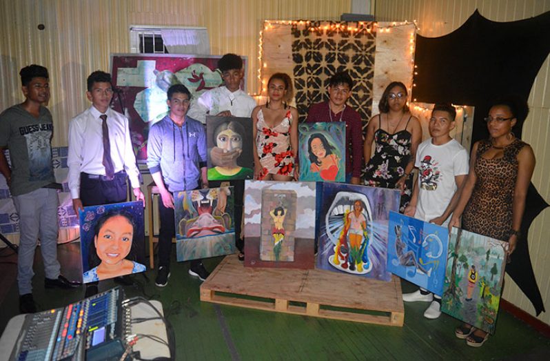 Kezyah Bhola (centre) and other students of the 2018 intermediate painting class of Burrowes School of Arts.