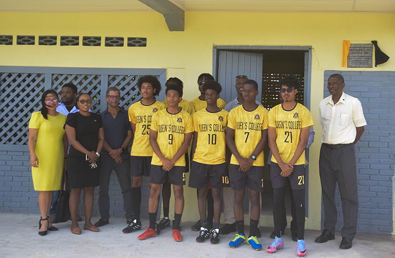 Students of Queen's College, along with former students and officials from Metallica CC Guyana Inc. at the new pavilion