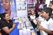 Students visited the Ministry of Labour and Manpower Planning booth at the opening of the Human Rights and Anti-Corruption Expo on Tuesday