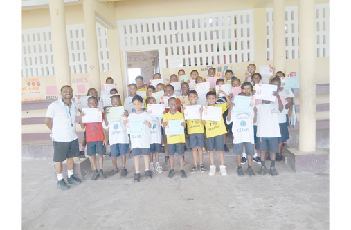 Some of the Under-11 students the academy works with at Tuschen Secondary School basketball court
